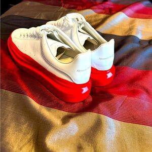 Very nice pair of white and red Alexander McQueen shoes. Worn once.